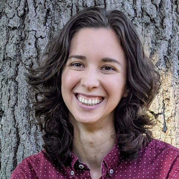 Portrait of Rey, a light skinned, dark haired nonbinary person