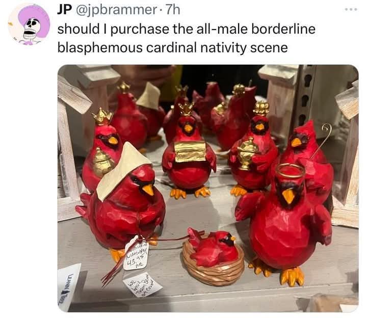 A Christian Nativity scene with Mary, the wise men, and baby Jesus all as bright red male cardinal birds